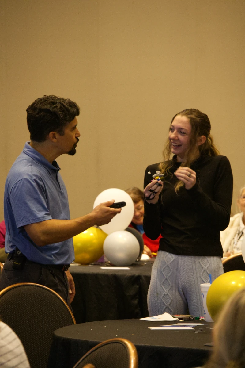andrew-berrigan-smiling-model-conversation Andrew Berrigan talking with a smiling participant who is holding a LEGO model